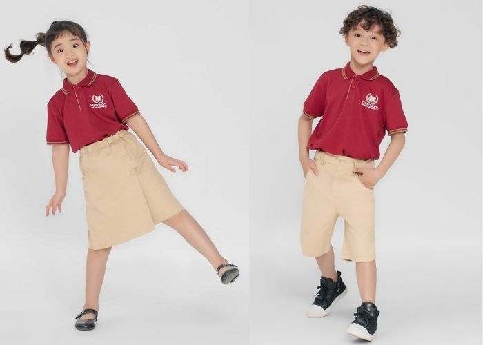 Trang phục học sinh tiểu học trường Vinschool với tông màu đỏ đô